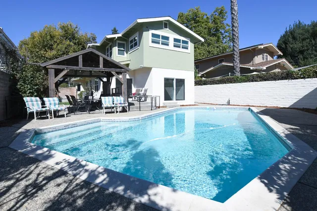 a view of a house with a yard and garage