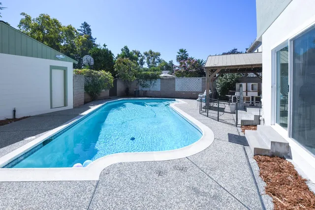 a view of a house with a yard and a garage