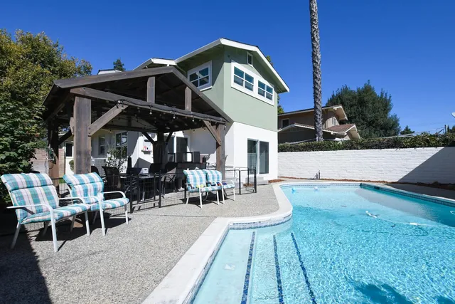 a view of a house with a yard and garage