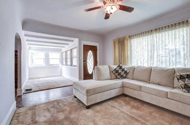 a living room with furniture and a large window