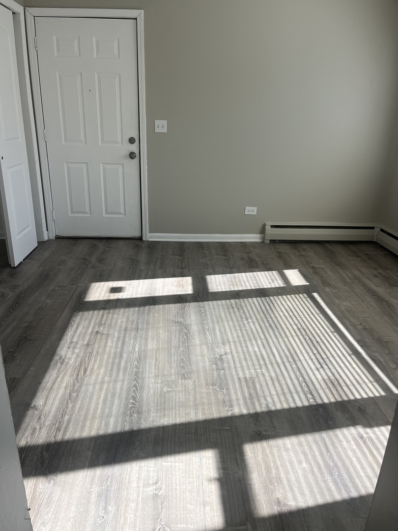 1340 North Main Street, Unit E4 Wheaton, IL 60187 - Photo 6 of 7 a view of wooden floor