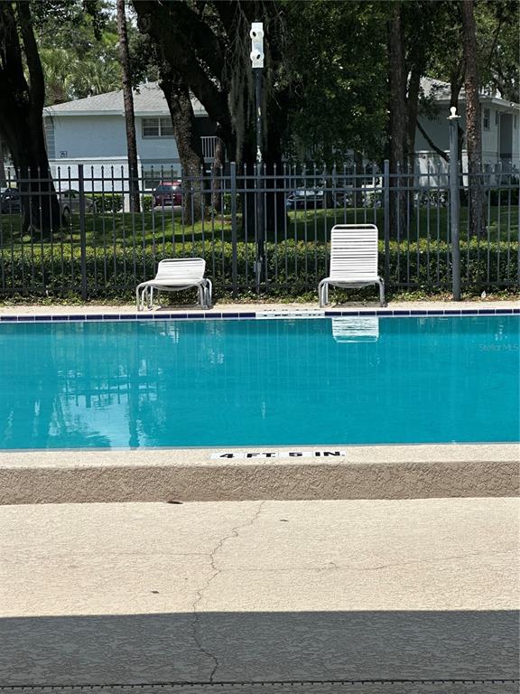 584 Fairways Lane, Unit F202 Ocala, FL 34472 - Photo 2 of 17 a view of garden with patio