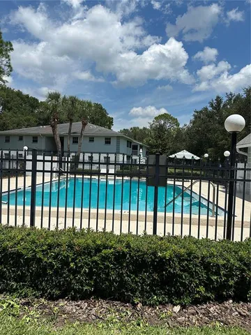 a view of swimming pool from balcony