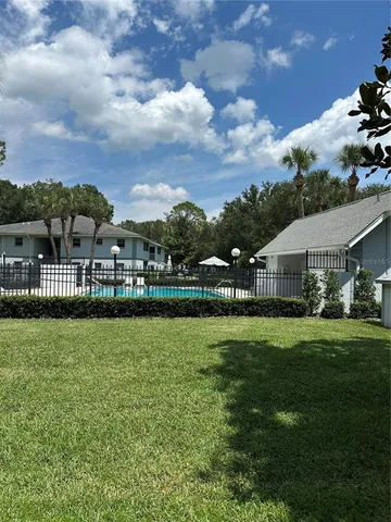 a view of a house with a big yard