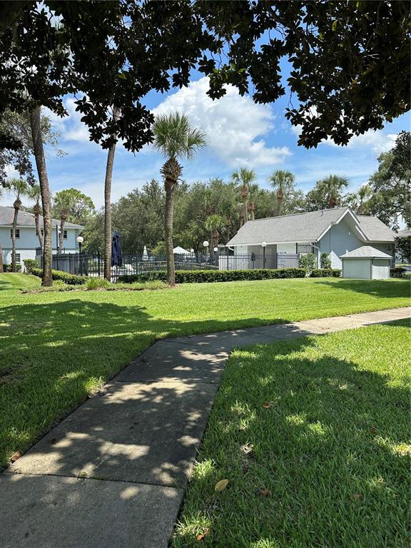 584 Fairways Lane, Unit F202 Ocala, FL 34472 - Photo 6 of 17 a view of a house with a big yard