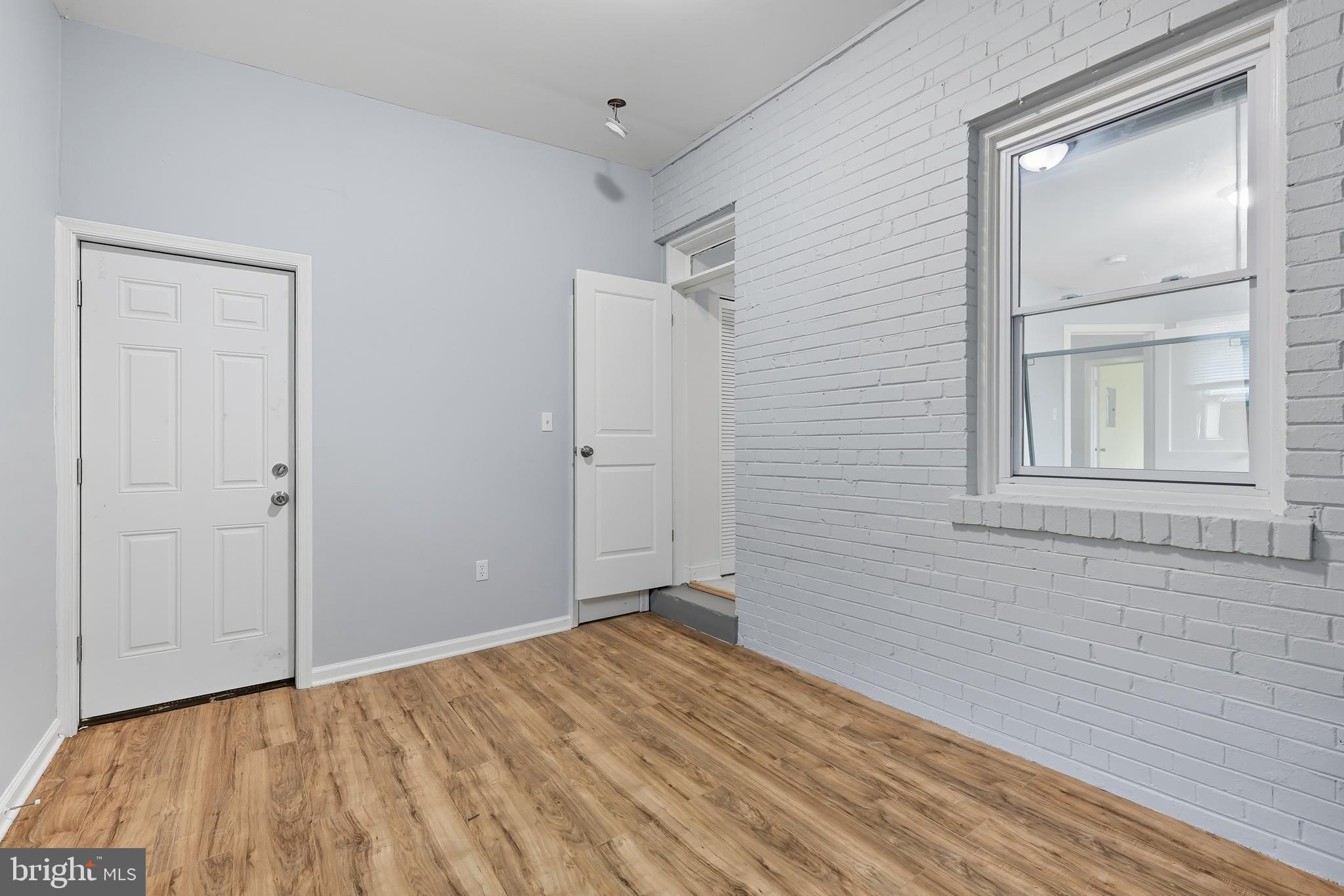 3919 R Street Southeast, Unit 2 Washington, DC 20020 - Photo 19 of 41 a view of empty room with wooden floor and fan