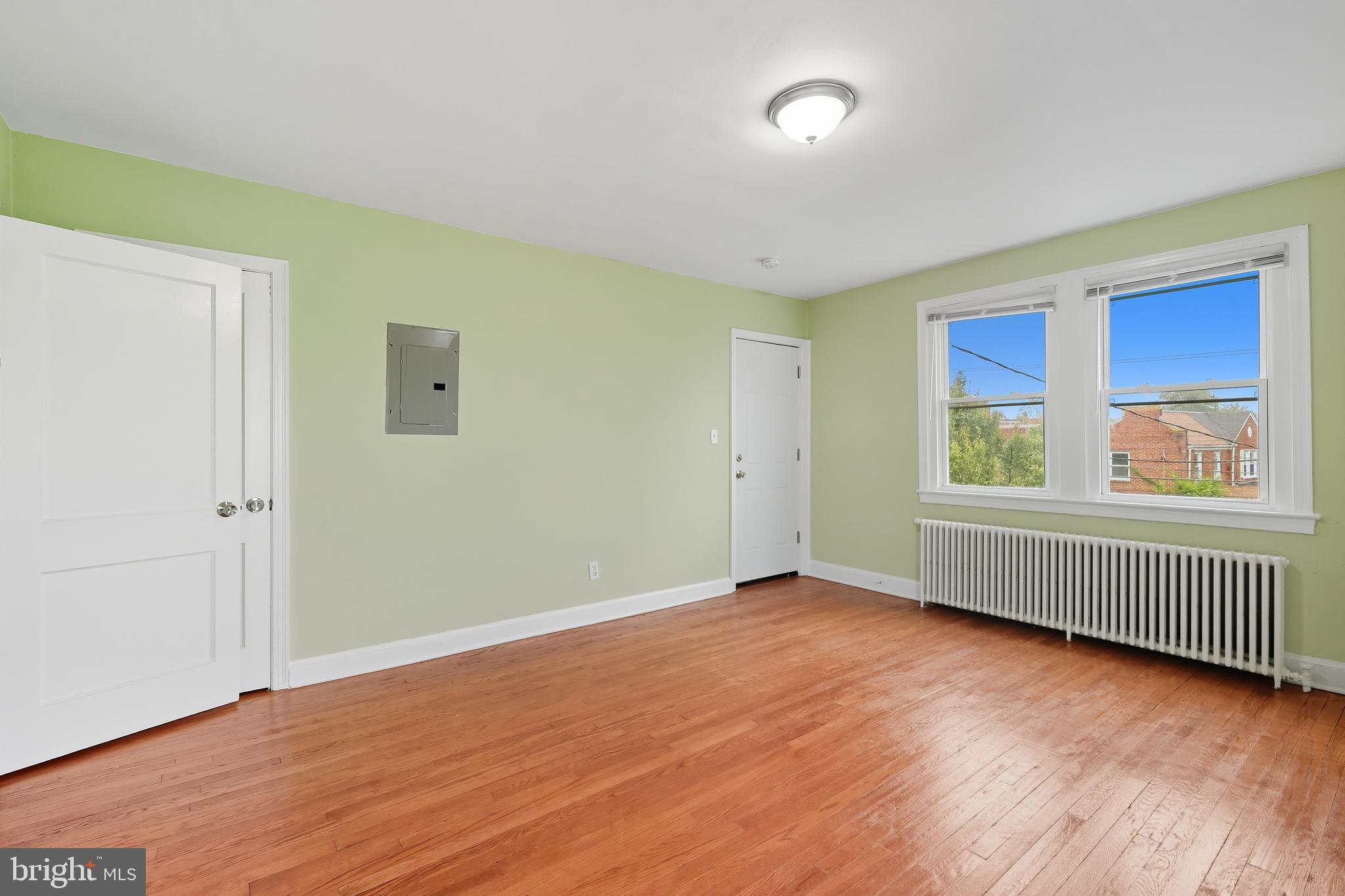 3919 R Street Southeast, Unit 2 Washington, DC 20020 - Photo 20 of 41 a view of an empty room with wooden floor and a window
