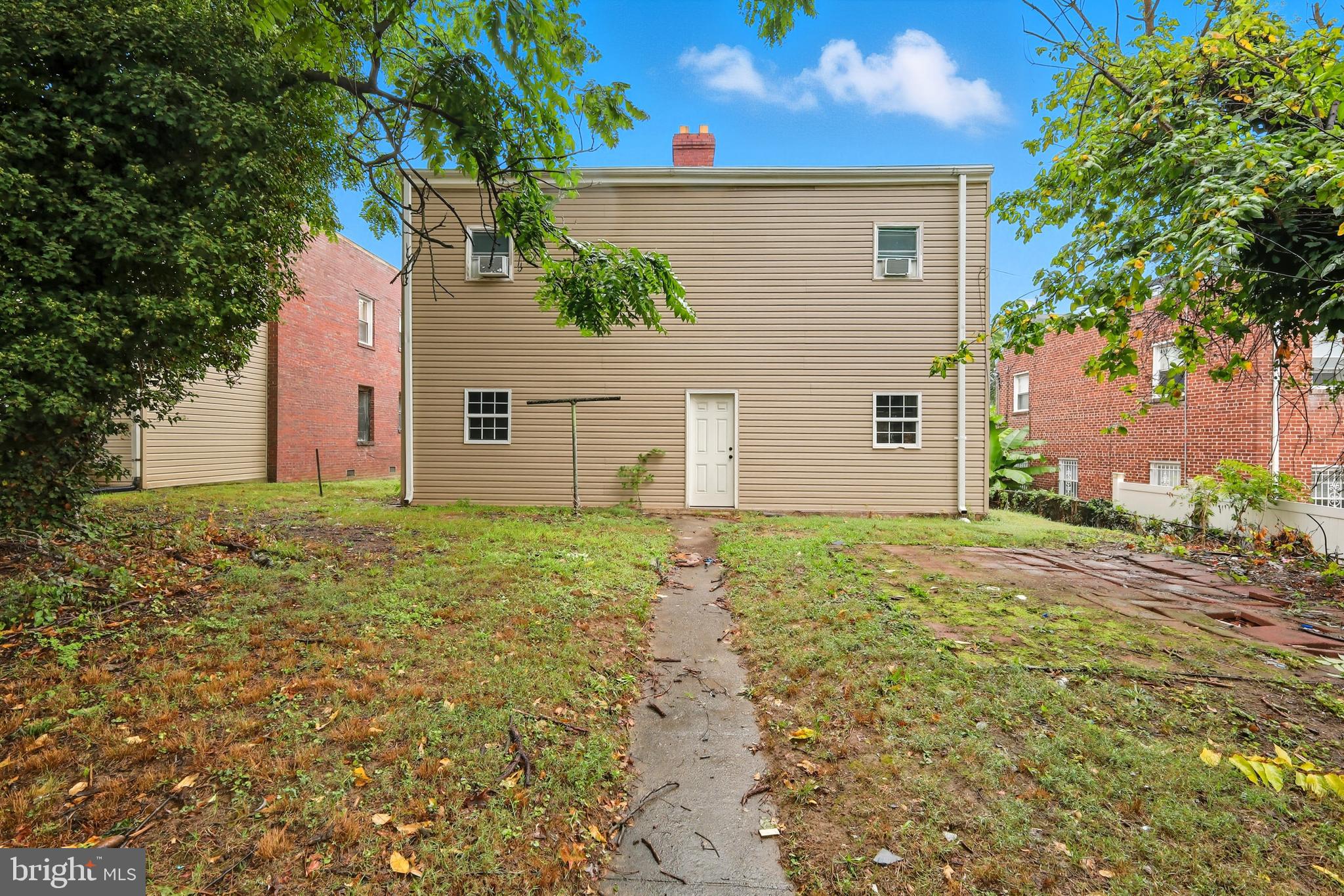 3919 R Street Southeast, Unit 2 Washington, DC 20020 - Photo 2 of 41 front view of a house with a yard