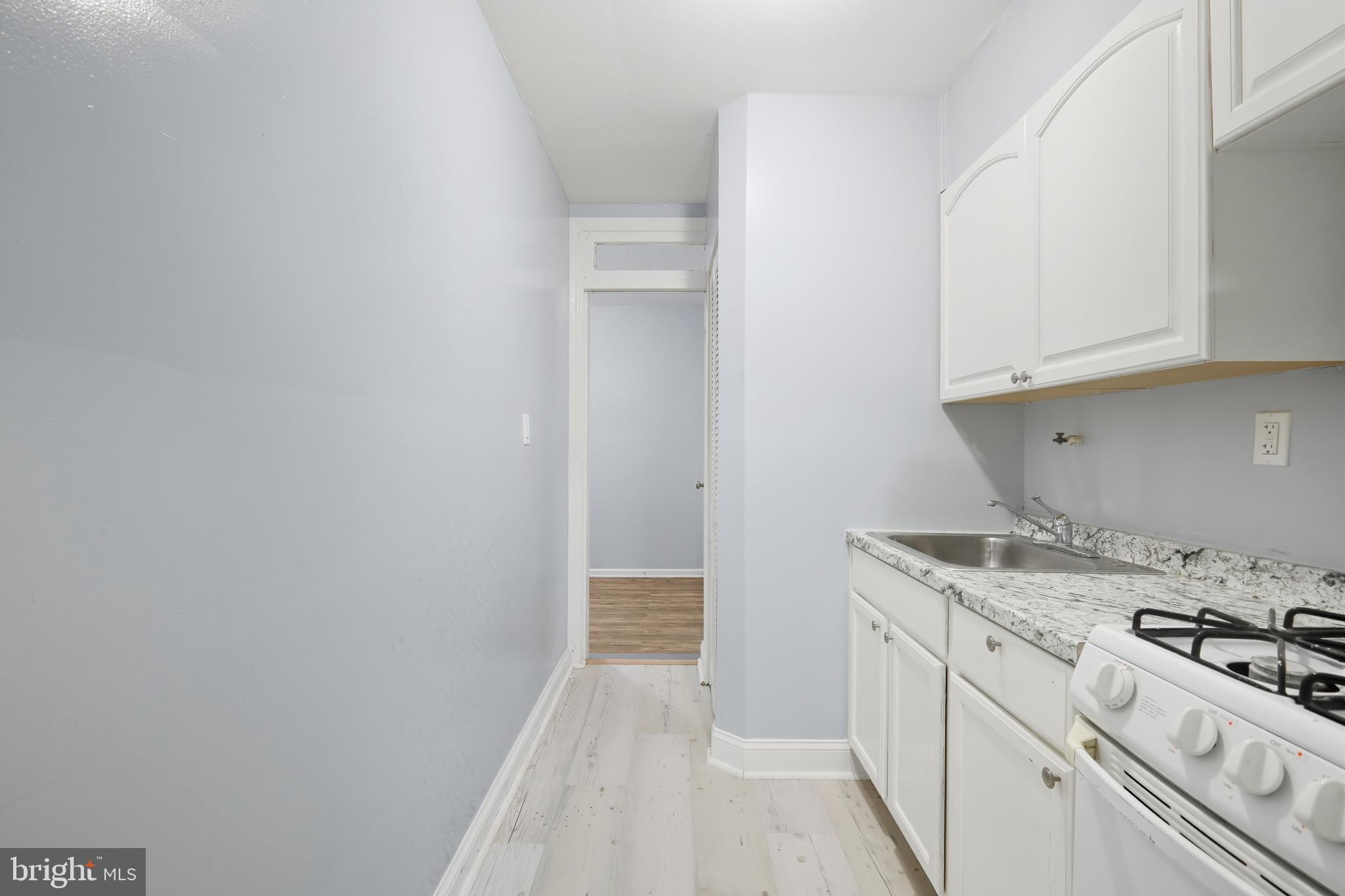 3919 R Street Southeast, Unit 2 Washington, DC 20020 - Photo 22 of 41 a kitchen with a sink and cabinets