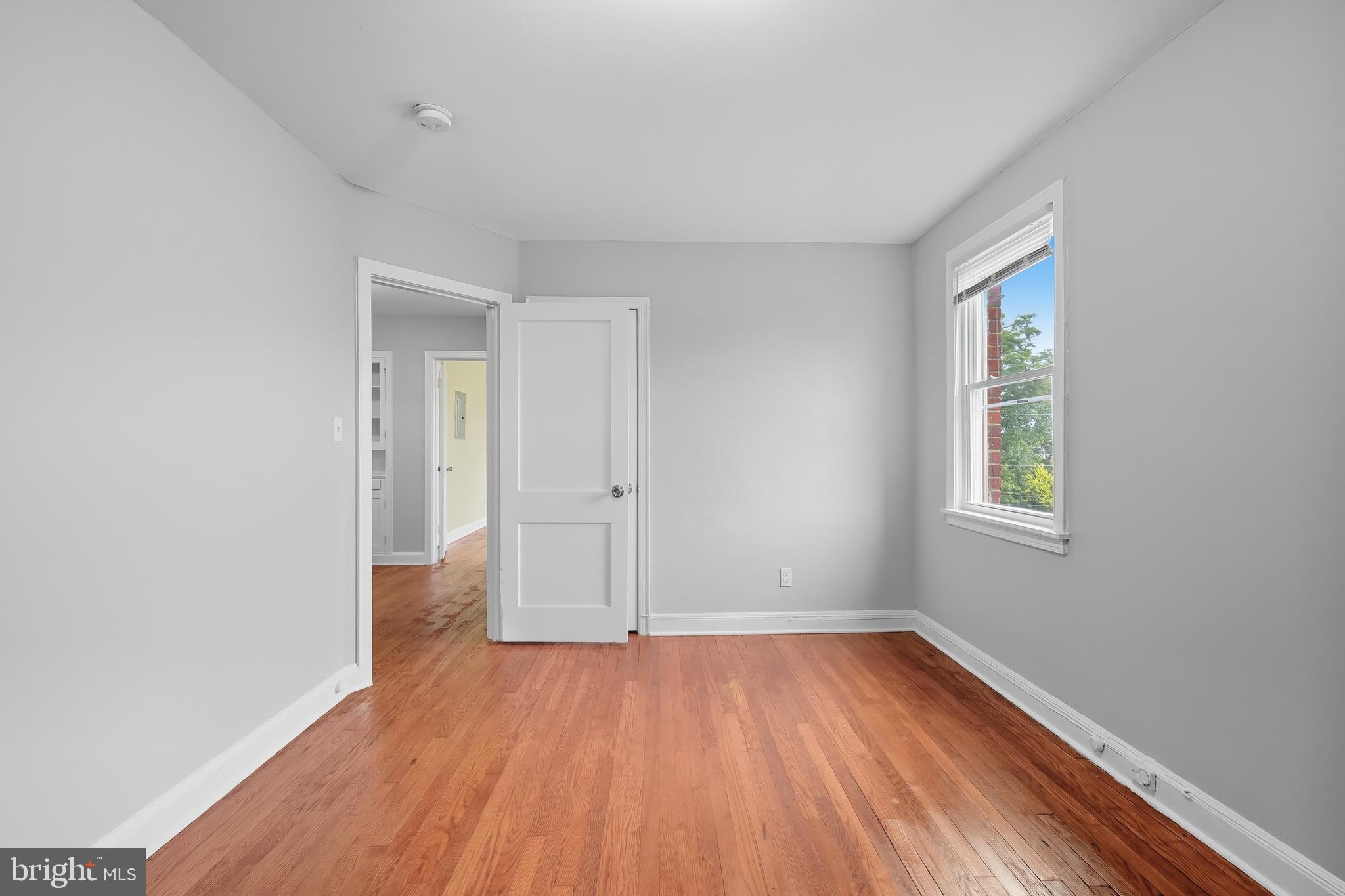 3919 R Street Southeast, Unit 2 Washington, DC 20020 - Photo 24 of 41 a view of empty room with wooden floor and fan