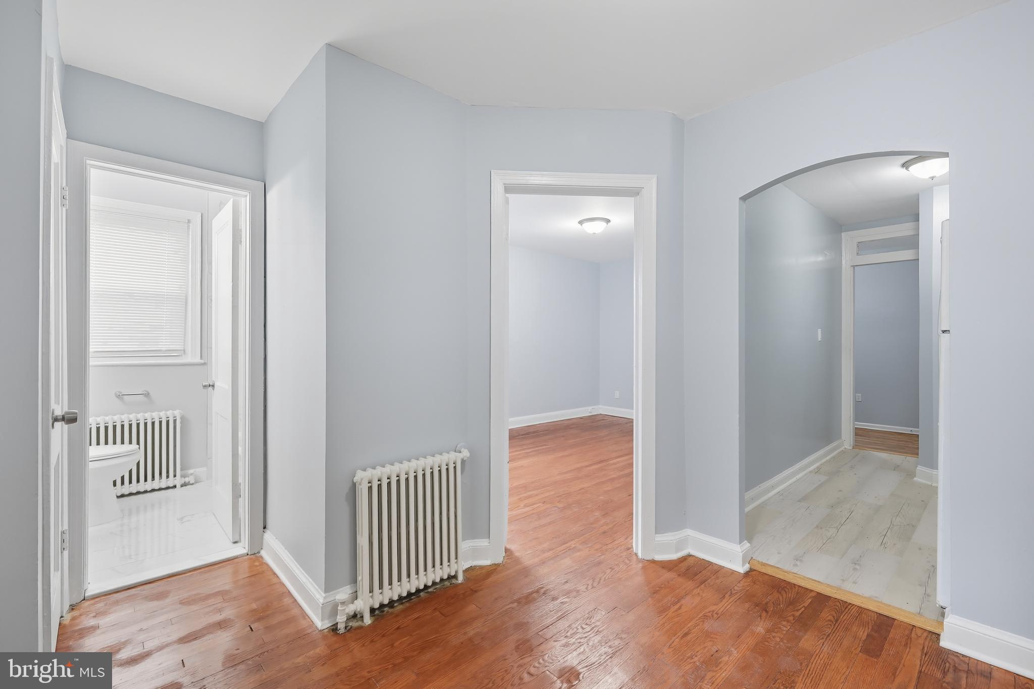 3919 R Street Southeast, Unit 2 Washington, DC 20020 - Photo 26 of 41 a view of a hallway with wooden floor and a bathroom