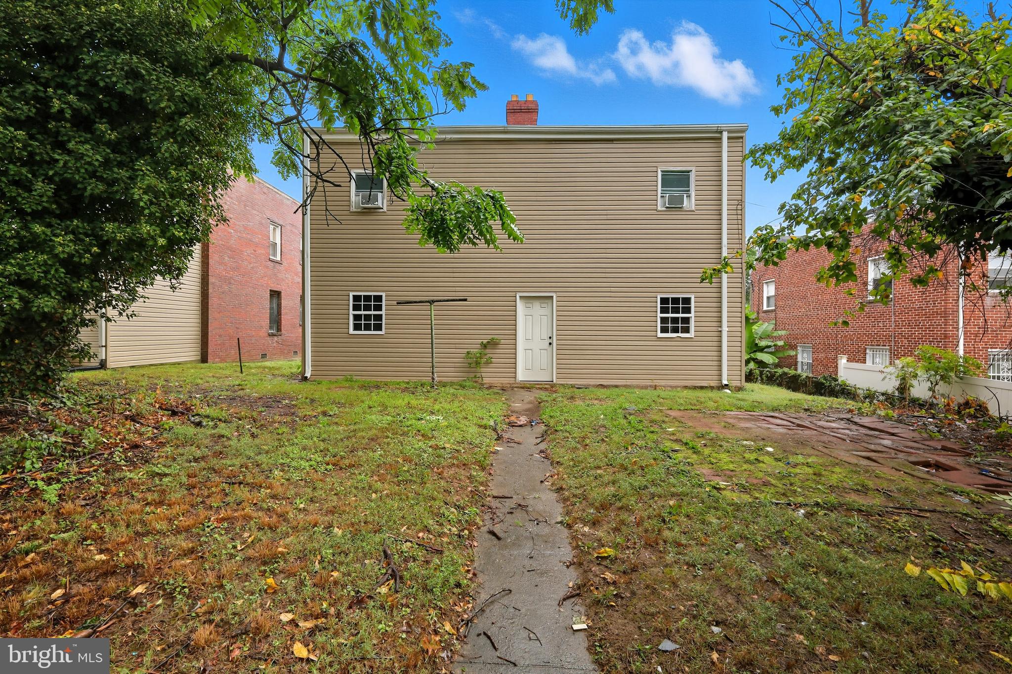 3919 R Street Southeast, Unit 2 Washington, DC 20020 - Photo 27 of 41 front view of a house with a yard