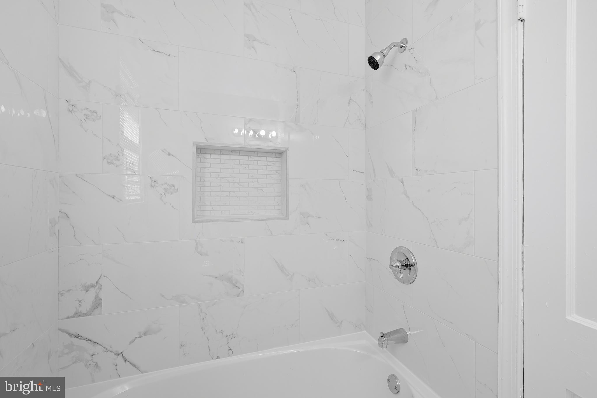 3919 R Street Southeast, Unit 2 Washington, DC 20020 - Photo 37 of 41 a bathroom with a bathtub