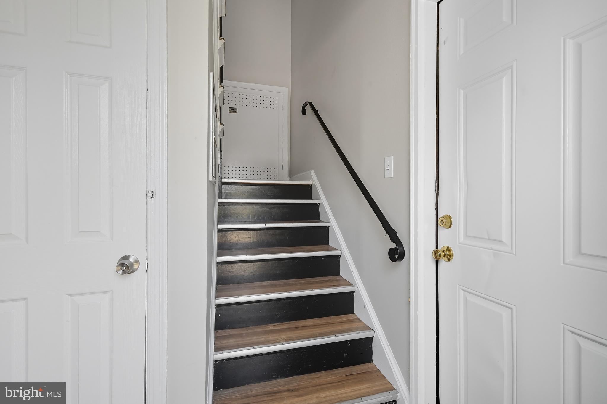 3919 R Street Southeast, Unit 2 Washington, DC 20020 - Photo 40 of 41 a view of staircase with wooden floor and white walls