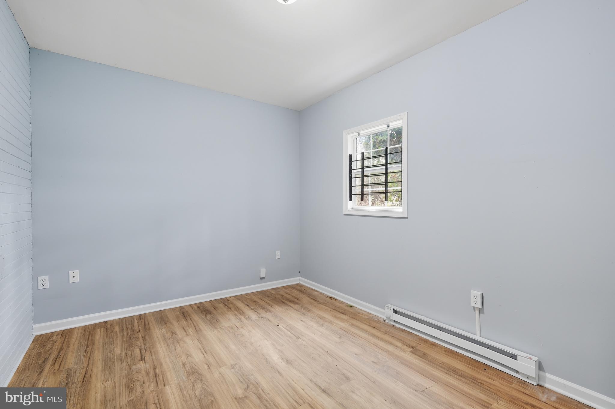 3919 R Street Southeast, Unit 2 Washington, DC 20020 - Photo 10 of 41 wooden floor in an empty room
