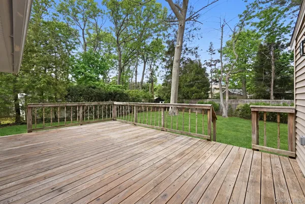 a view of deck with a large trees