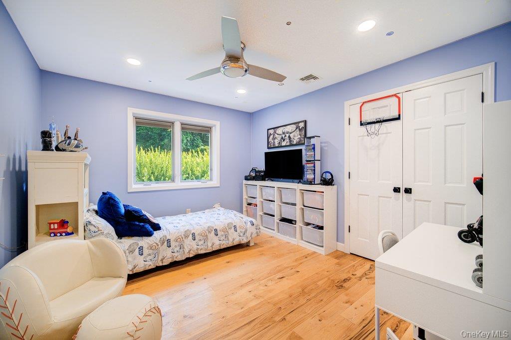 237 Mineral Springs Road Highland Mills, NY 10930 - Photo 19 of 32 Bedroom featuring light wood-type flooring, ceiling fan, a closet, and recessed lighting