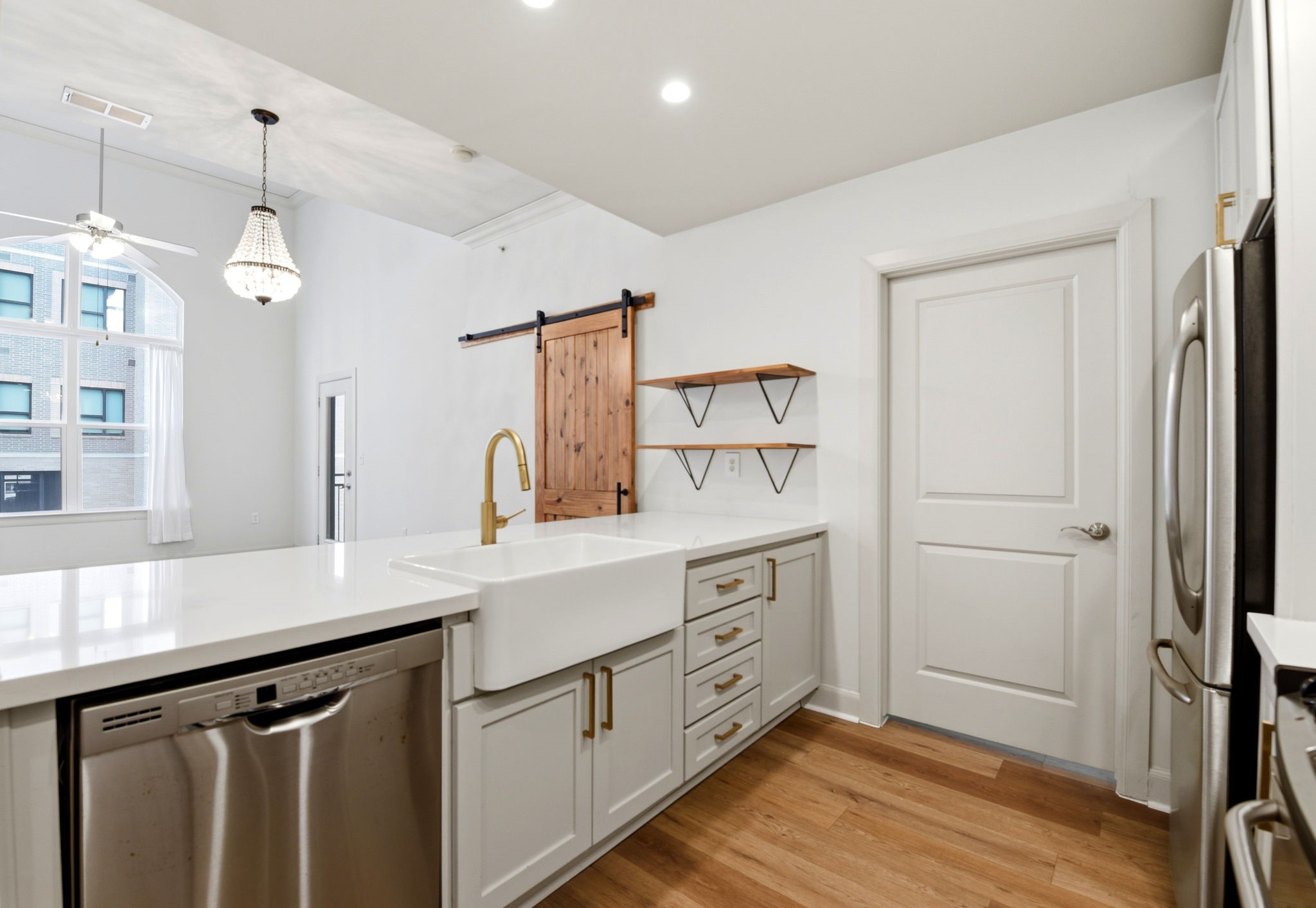 1010 Rosine Street, Unit 43 Houston, TX 77019 - Photo 10 of 48 a kitchen with white cabinets and sink