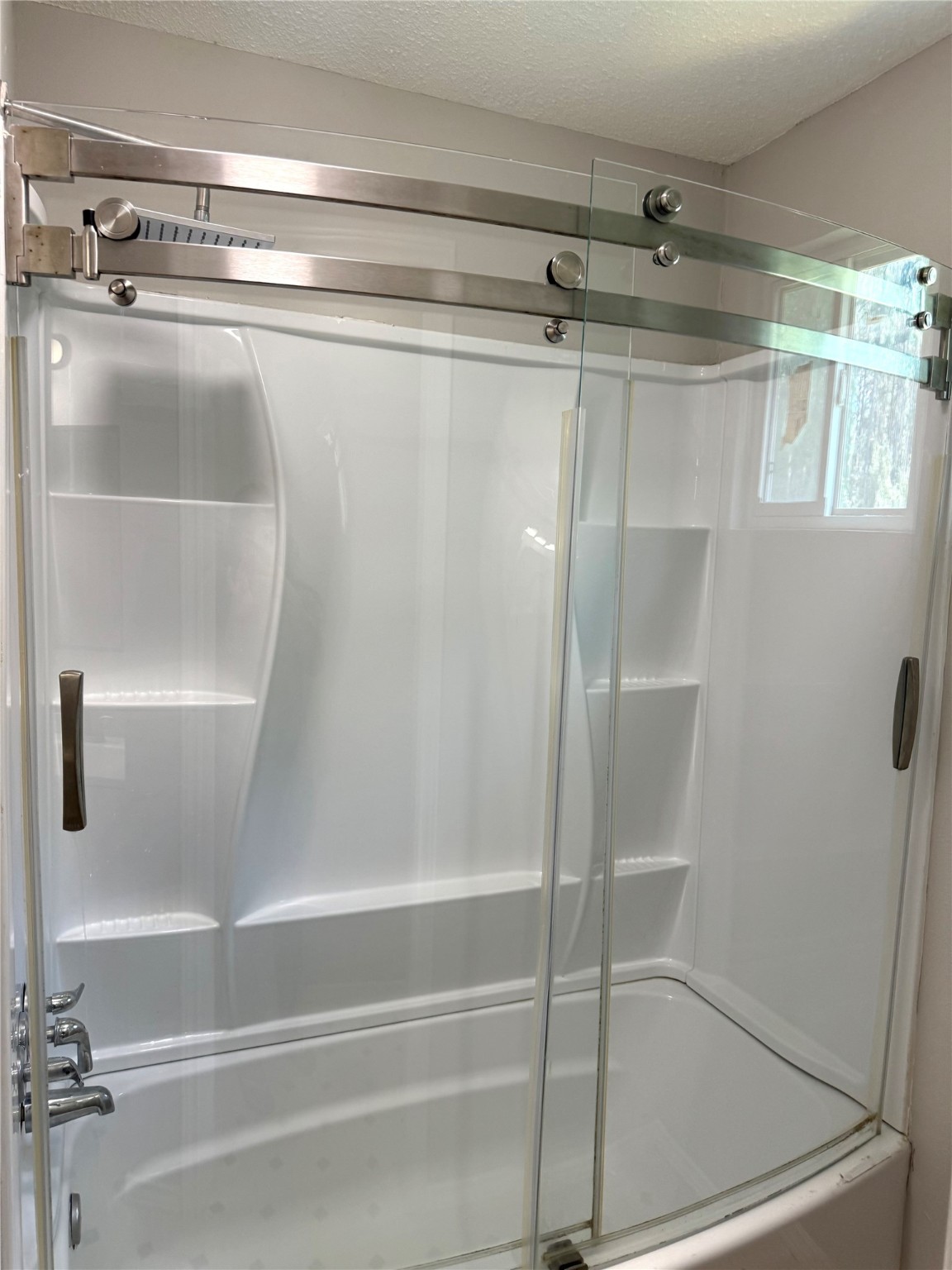 9822 Candy Court, Unit B Spring, TX 77379 - Photo 15 of 27 a bathroom with a shower