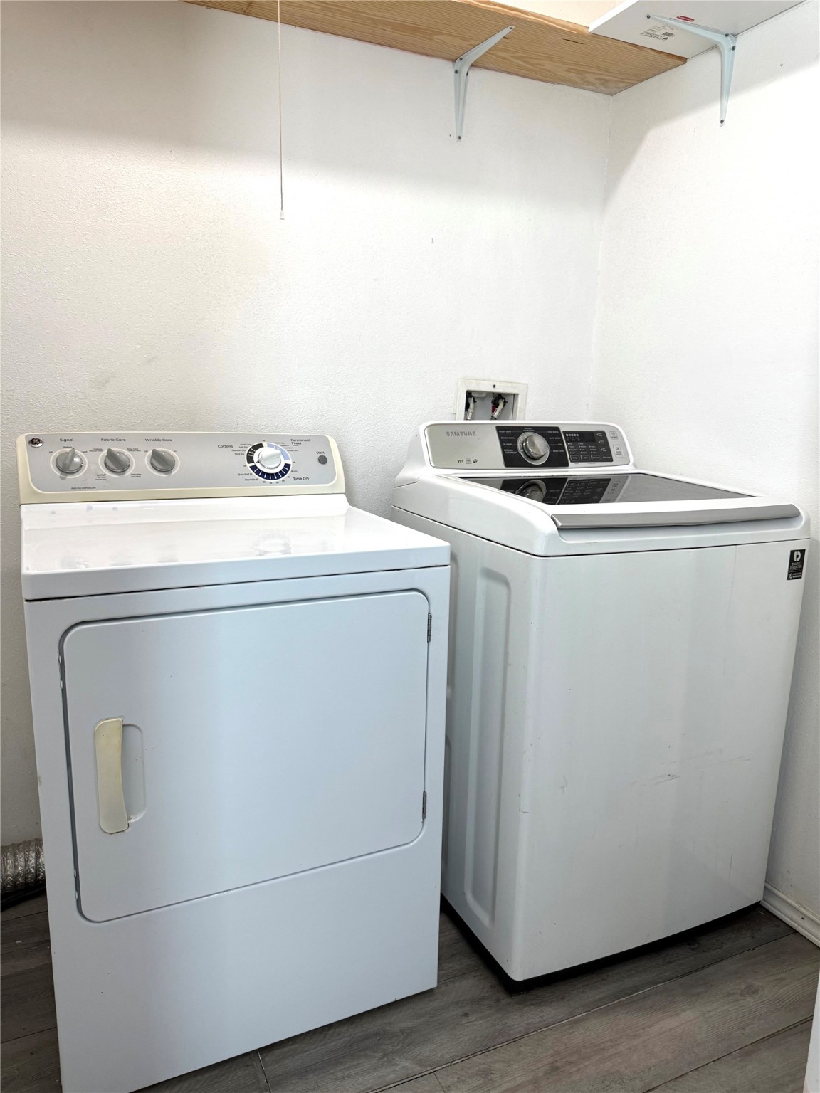9822 Candy Court, Unit B Spring, TX 77379 - Photo 19 of 27 a utility room with dryer and washer