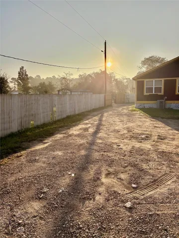 a view of a car is parked in the middle of a field