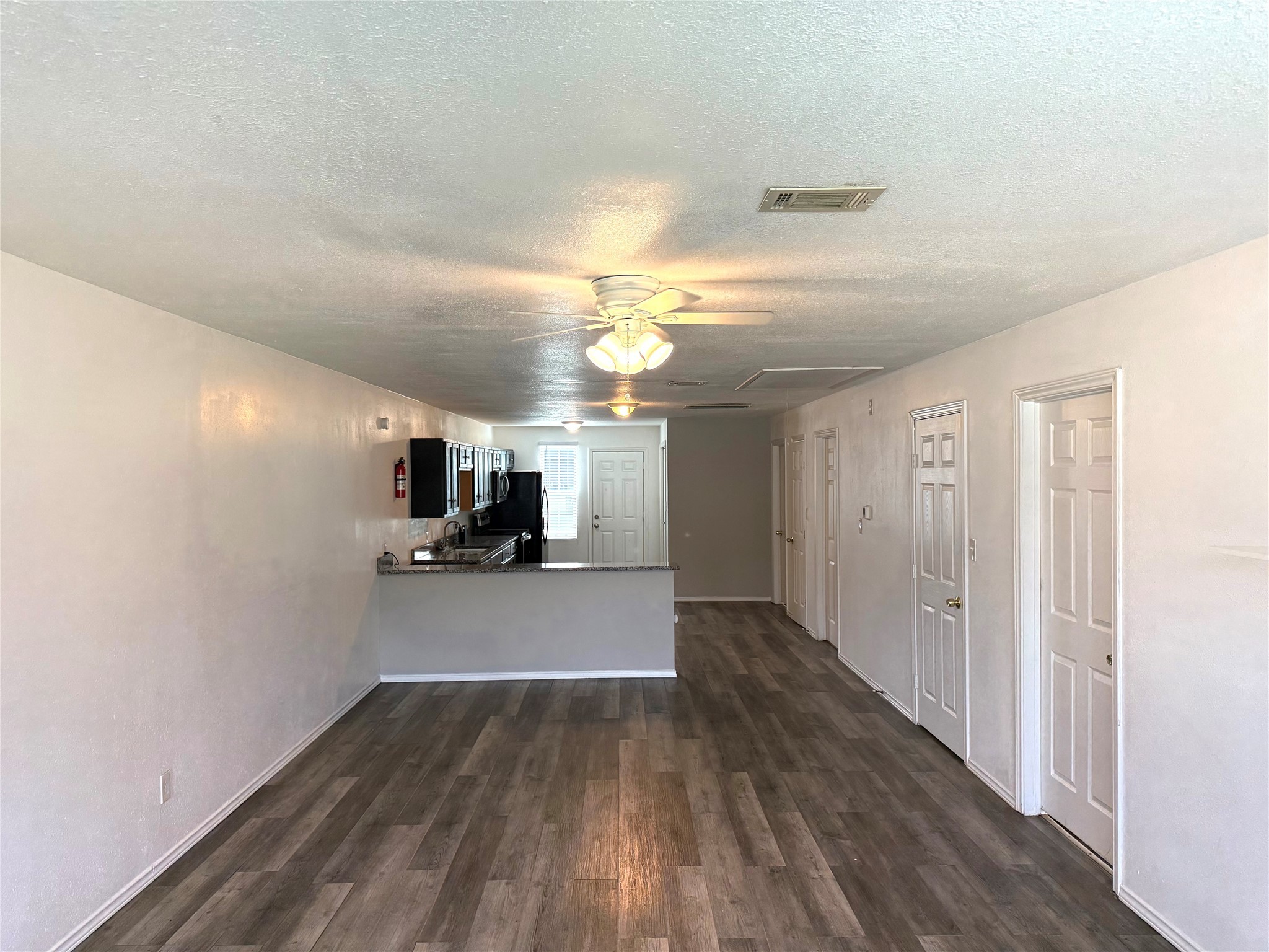 9822 Candy Court, Unit B Spring, TX 77379 - Photo 5 of 27 a view of a house and wooden floor