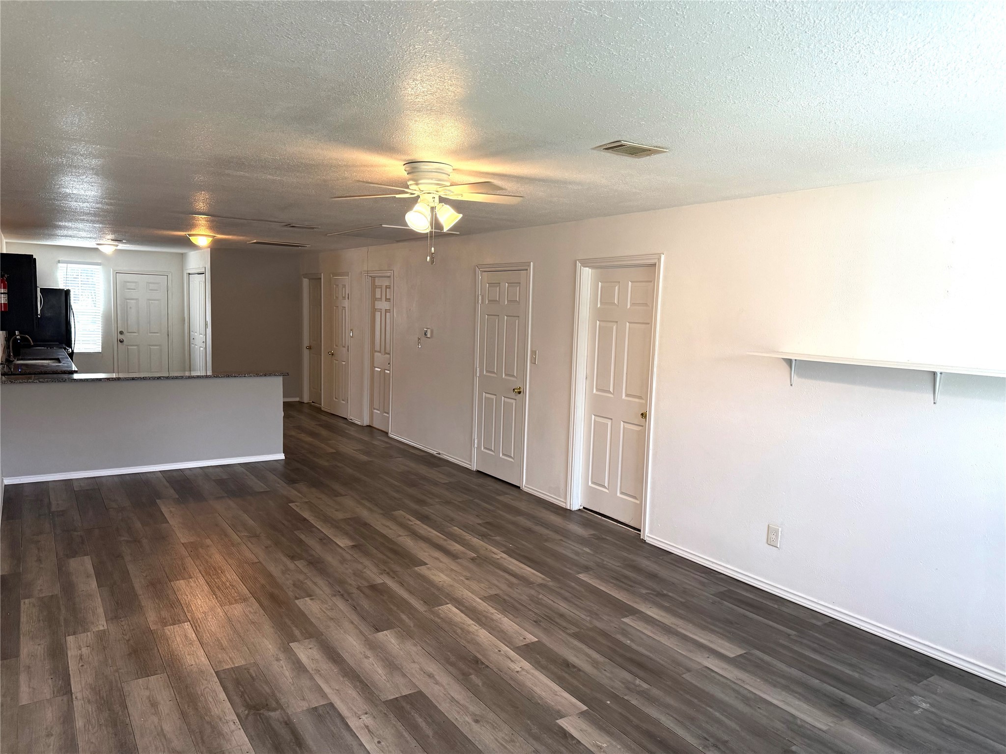 9822 Candy Court, Unit B Spring, TX 77379 - Photo 6 of 27 wooden floor in an empty room