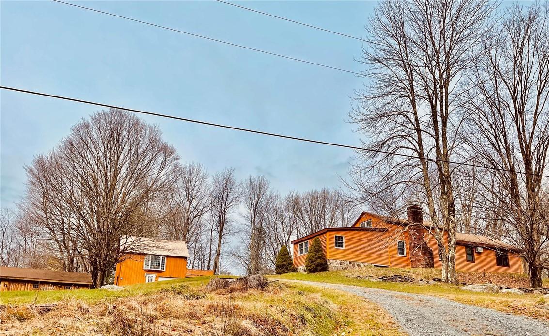 670 Creamery Road Bethel, NY 12762 - Photo 1 of 1 a front view of a house with a yard