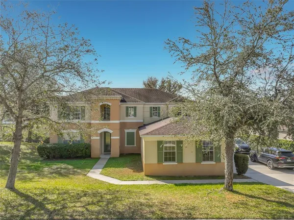a front view of a house with a yard