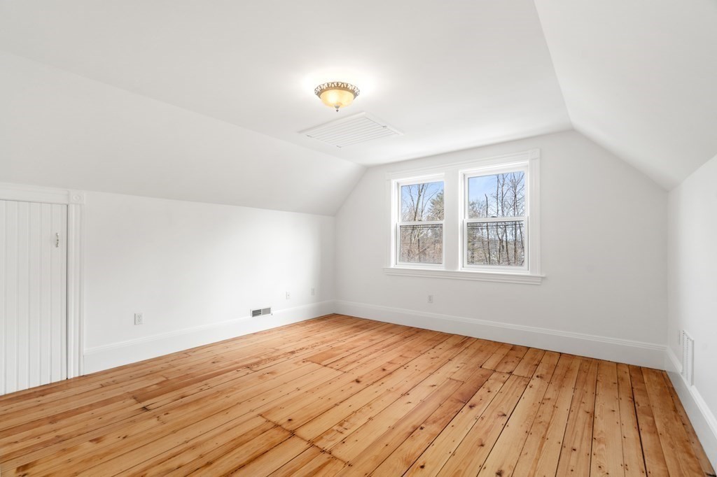302 Concord Road Weston, MA 02493 - Photo 14 of 27 wooden floor in an empty room with a window