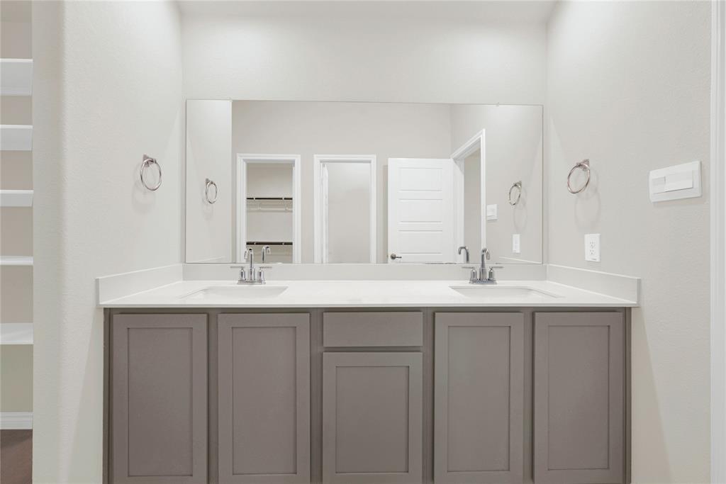 9713 Quail Pointe Road Aubrey, TX 76227 - Photo 17 of 23 Full bath featuring double vanity and a spacious closet