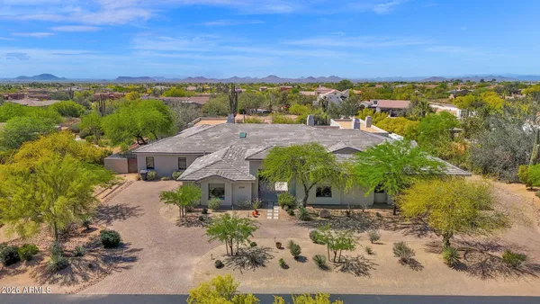 an aerial view of a house with a garden