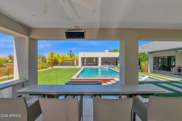 a large kitchen with stainless steel appliances lots of counter space and a sink
