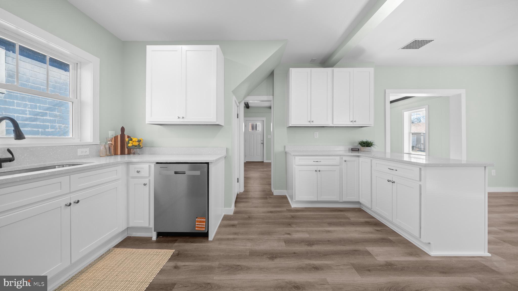 603 East Chestnut Street Delmar, MD 21875 - Photo 7 of 33 a kitchen with white cabinets and sink