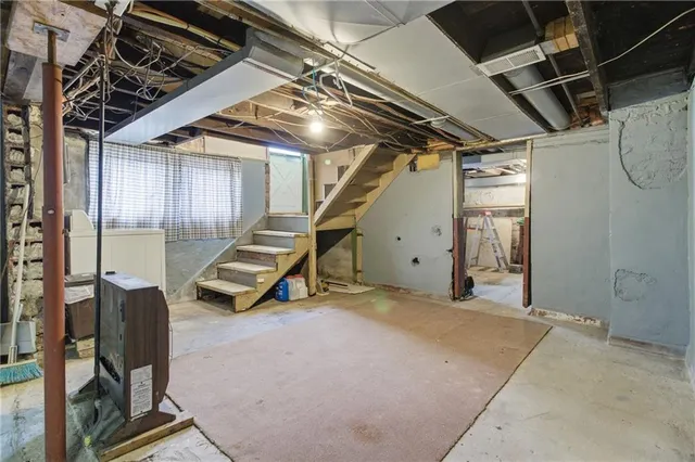 a view of an empty room with windows