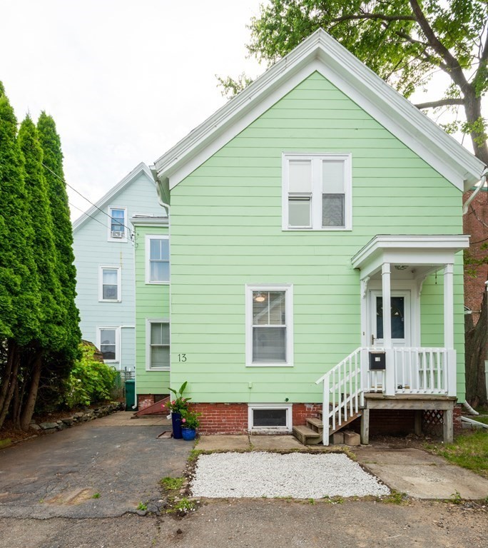 13 Melville Place Lynn, MA 01902 - Photo 1 of 41 a front view of a house with a yard