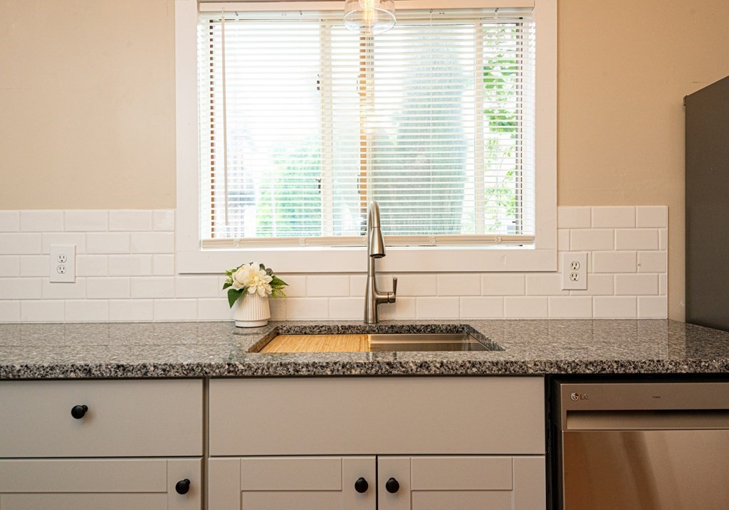 13 Melville Place Lynn, MA 01902 - Photo 11 of 41 a bathroom with a granite countertop sink and a mirror
