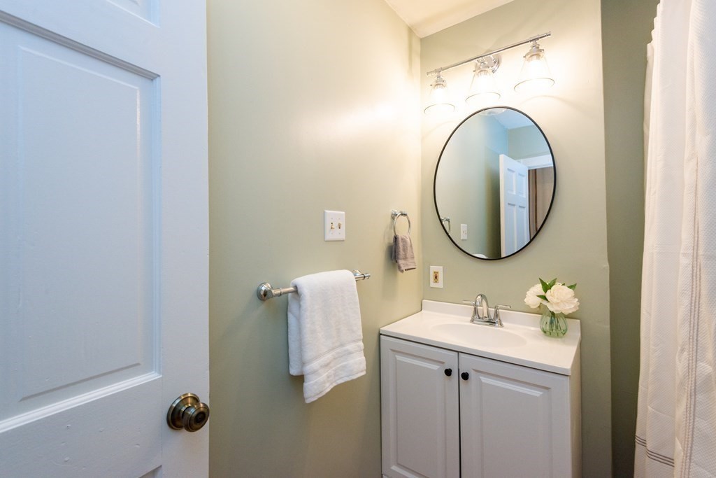 13 Melville Place Lynn, MA 01902 - Photo 15 of 41 a bathroom with a sink and a mirror