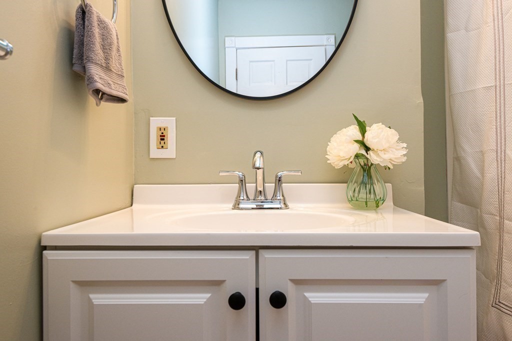 13 Melville Place Lynn, MA 01902 - Photo 16 of 41 a bathroom with a sink and a mirror