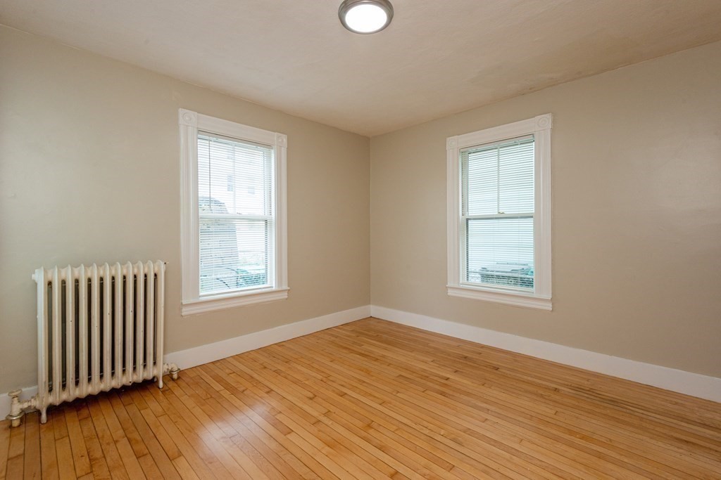 13 Melville Place Lynn, MA 01902 - Photo 19 of 41 a view of an empty room with wooden floor and a window