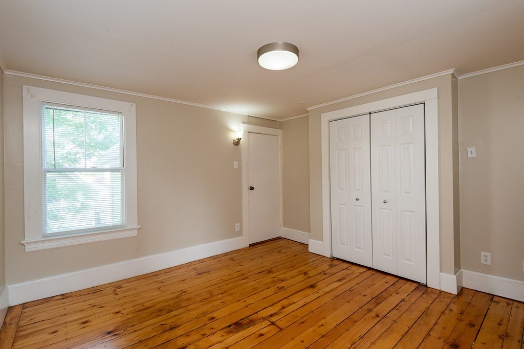 13 Melville Place Lynn, MA 01902 - Photo 25 of 41 a view of empty room with wooden floor and fan