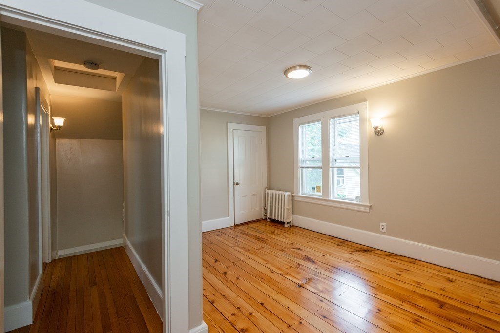 13 Melville Place Lynn, MA 01902 - Photo 29 of 41 a view of empty room with wooden floor and fan