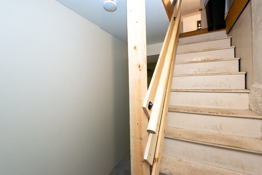 13 Melville Place Lynn, MA 01902 - Photo 32 of 41 a view of staircase with white walls and a window