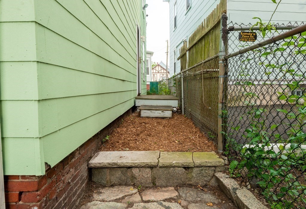13 Melville Place Lynn, MA 01902 - Photo 38 of 41 a view of a backyard door and outdoor seating
