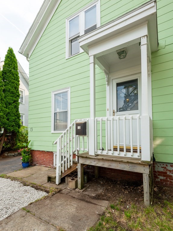 13 Melville Place Lynn, MA 01902 - Photo 41 of 41 a porch with a bench and chairs