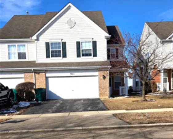 a view of a white apartments with large windows