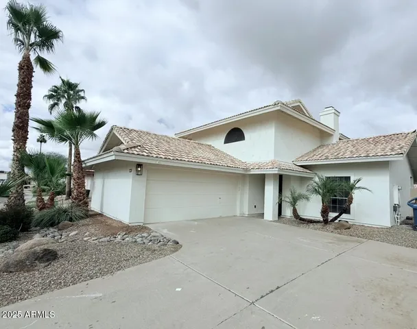 a house view with a backyard space