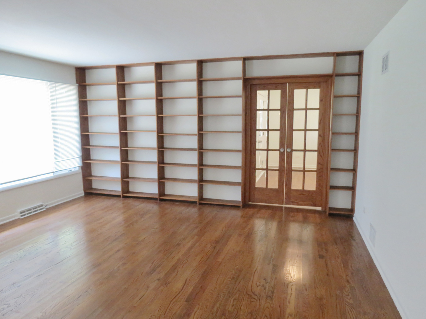 12970 McCarthy Road Lemont, IL 60439 - Photo 11 of 46 wooden floor in an empty room with a window