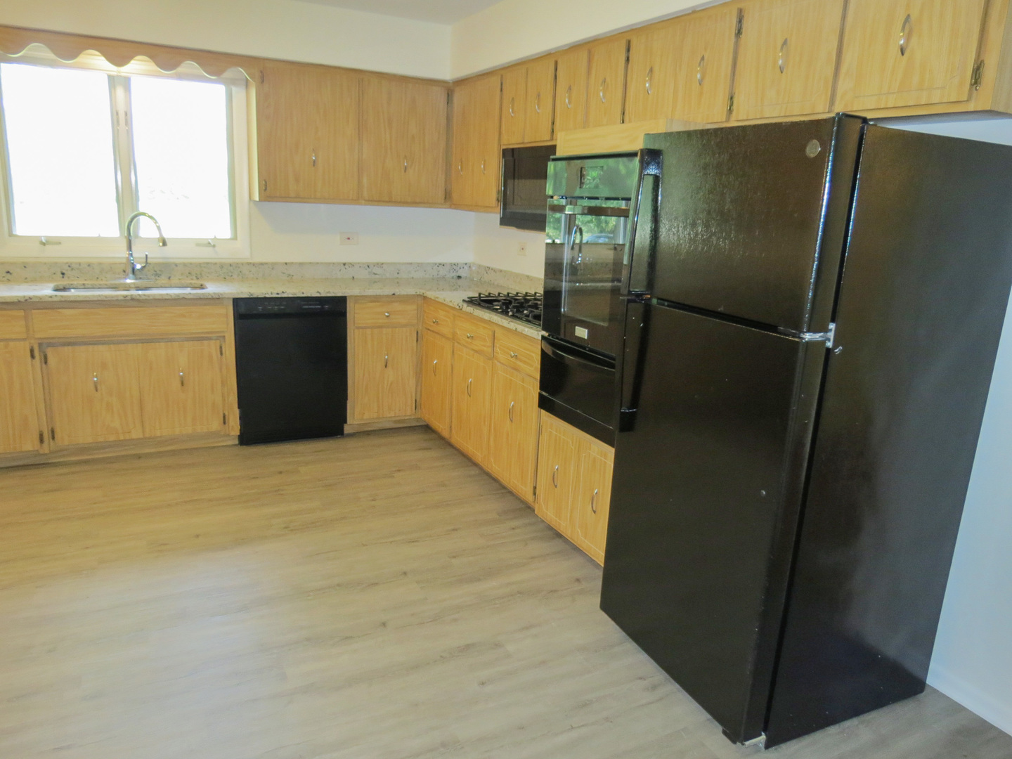 12970 McCarthy Road Lemont, IL 60439 - Photo 15 of 46 a kitchen with stainless steel appliances a refrigerator sink and cabinets