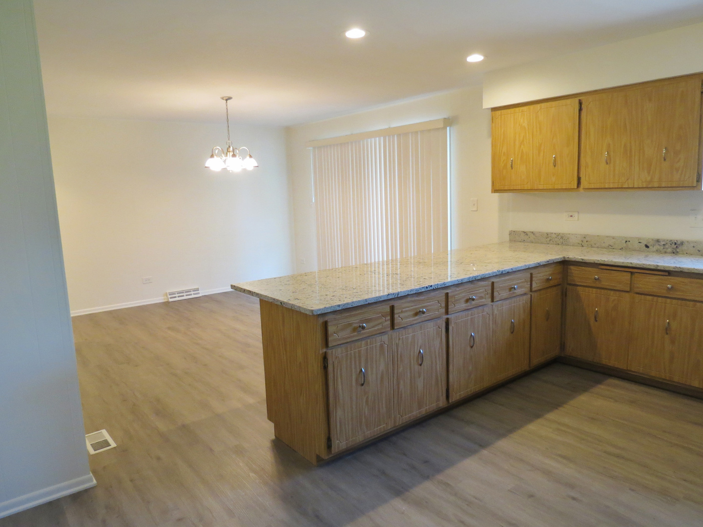12970 McCarthy Road Lemont, IL 60439 - Photo 17 of 46 a kitchen with sink cabinets and wooden floor